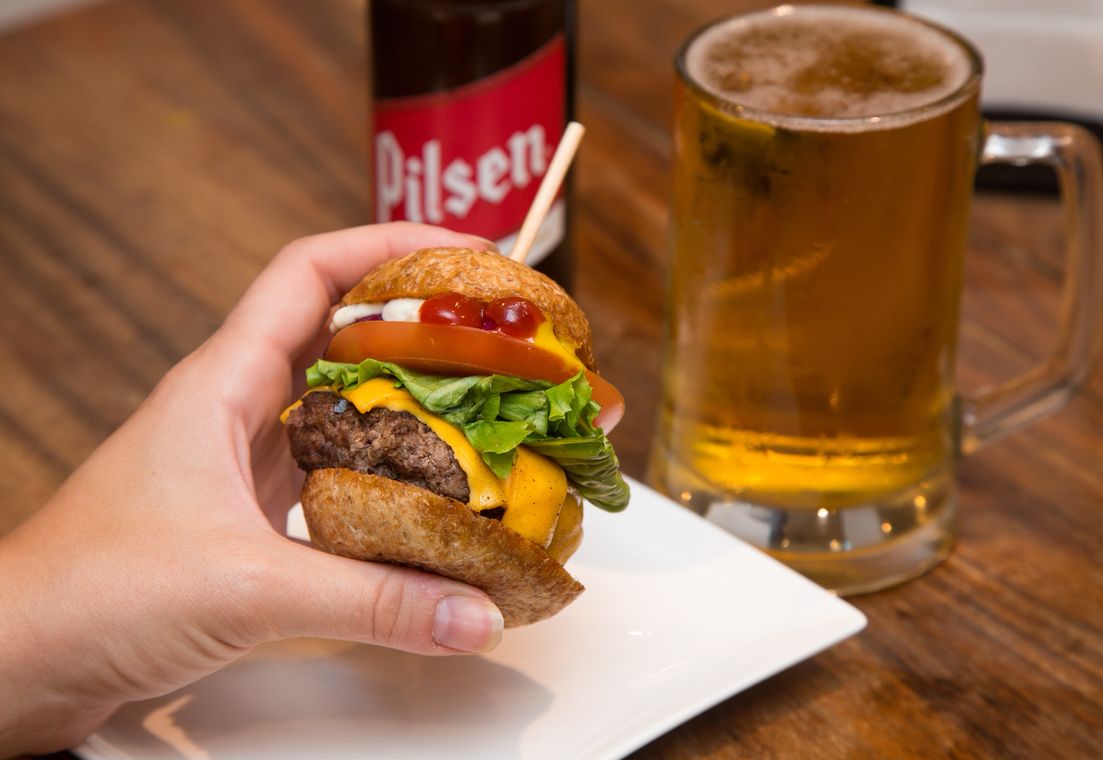 The Surf Club burger with a cold beer